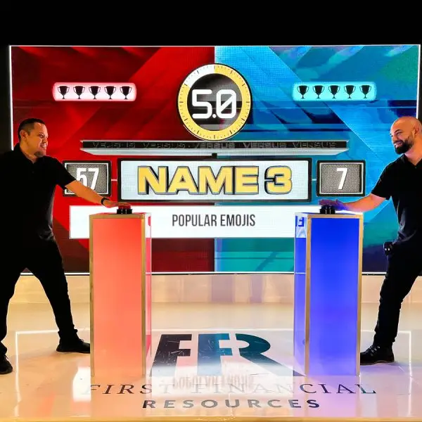 Two men playing a game show for a corporate event in Los Angeles- Hitting game buzzers